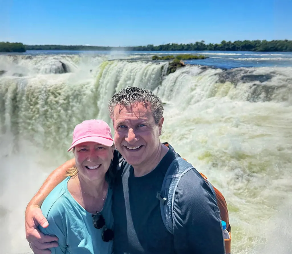 John and Mary feeling Iguazu Falls' spray and power up close