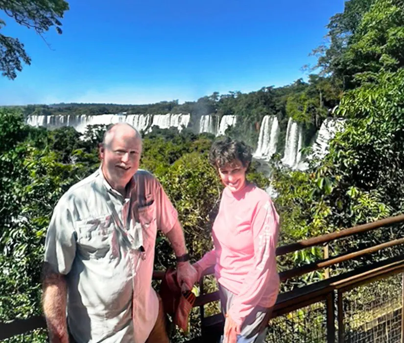 Steve and Cindy framed by the Iguazu Falls
