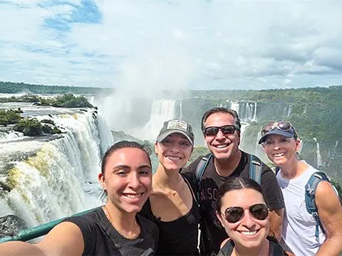 The Resnick family up close with the thundering Iguazu Falls