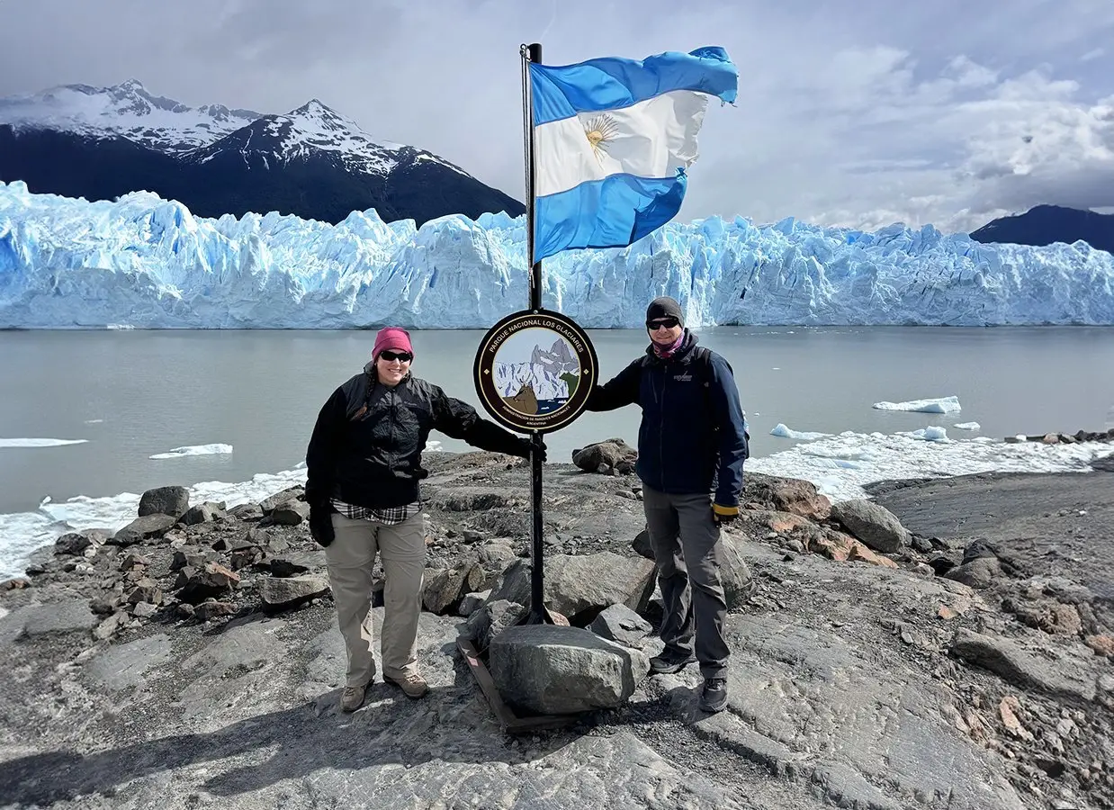 Adam and Kasey standing before the grandeur of Perito Moreno Glacier