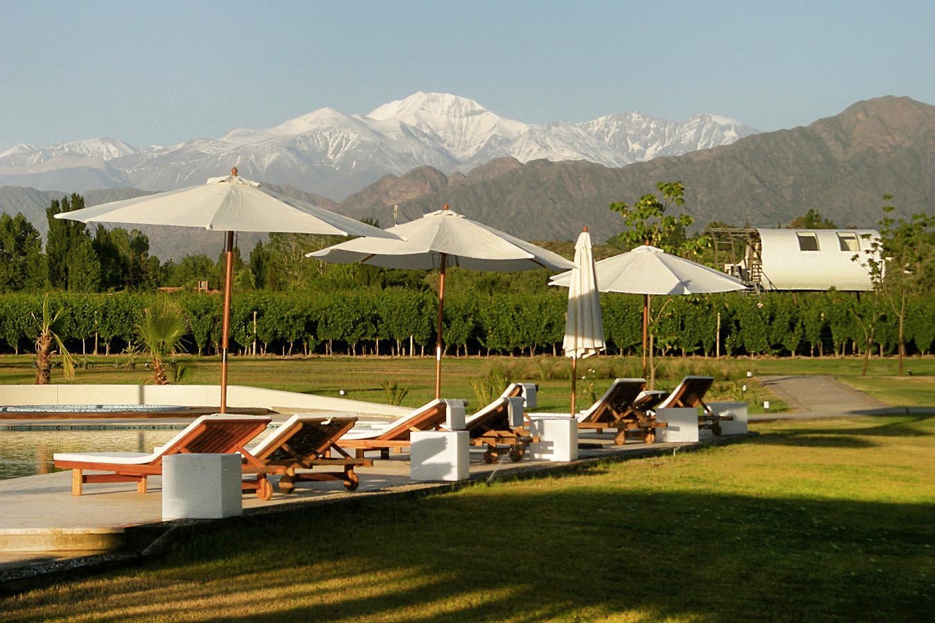 The hotel is surrounded by snow-capped Andes mountain range