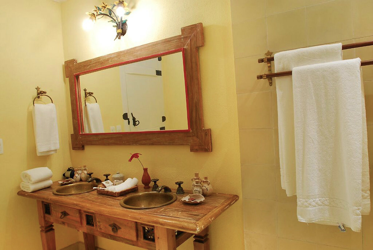 Each bathroom has unique furnishings in antique or colonial styles