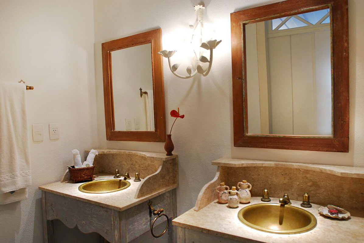 Each bathroom has unique furnishings in antique or colonial styles