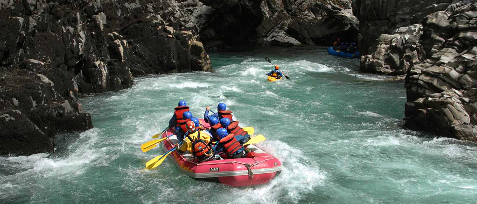 Rafting through an imposing canyon at a brisk pace