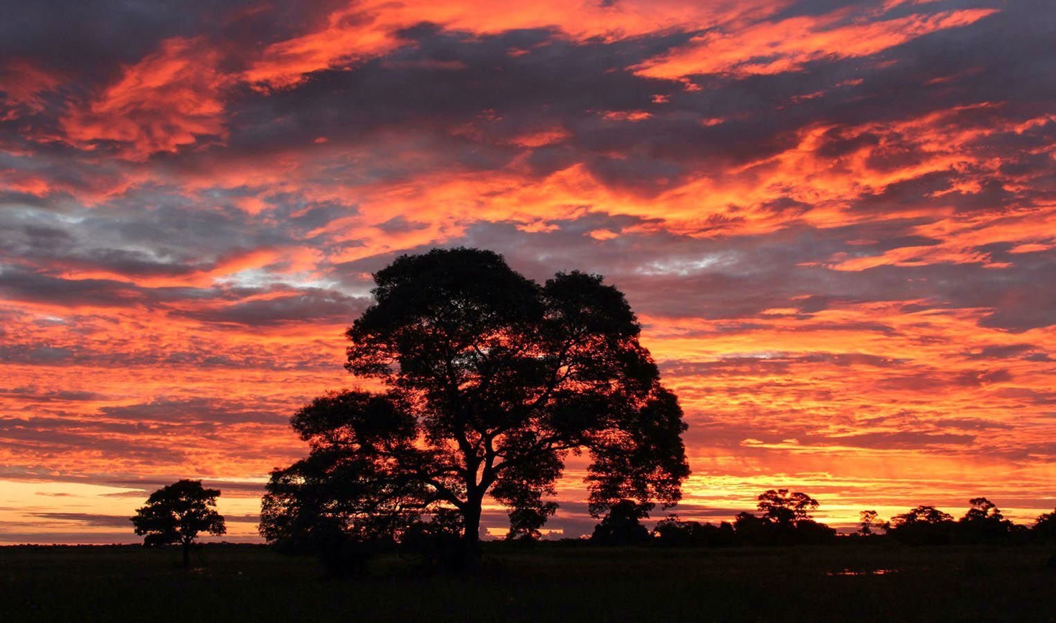 The vibrant and varied colors of the sky as the sun slowly sinks below the horizon