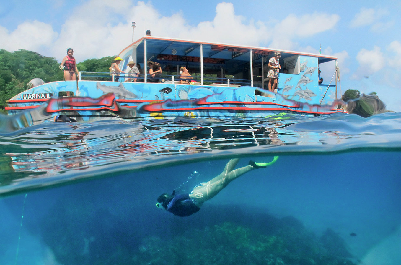 Embark on a boat adventure to discover the most beautiful spots on Fernando de Noronha island