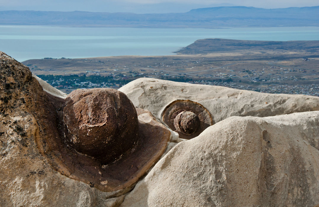 The Hat Rocks (found in only four places on Earth) with the backdrop of the city of El Calafate