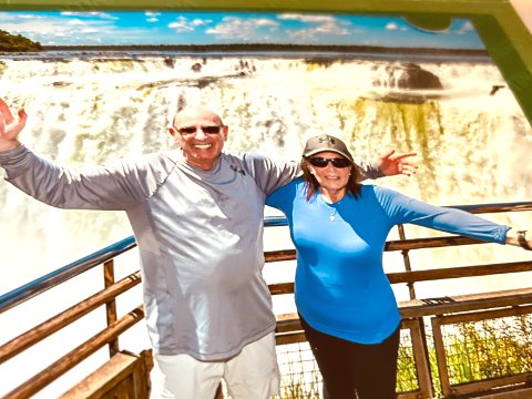 Arms wide to Iguazu Falls' thundering rainbow mist