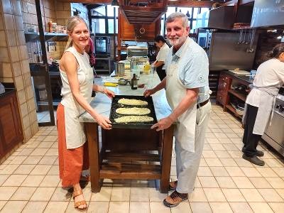 Rolling dough side by side at a Mendoza cooking class