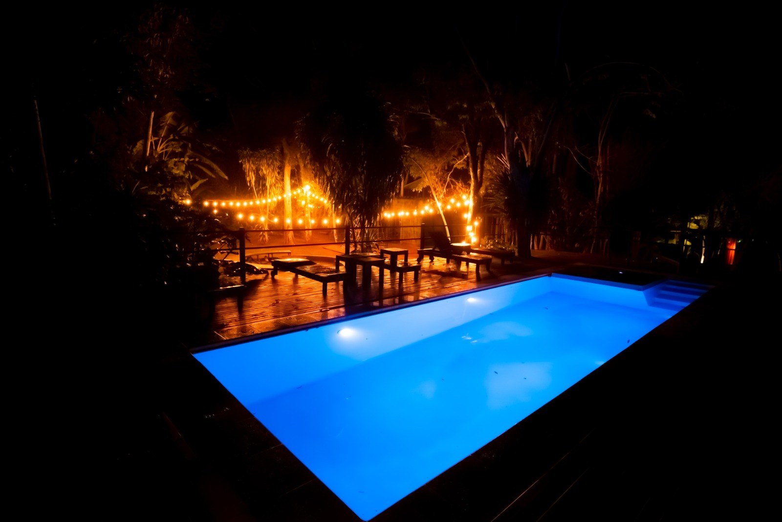 The lodge’s outdoor pool at night