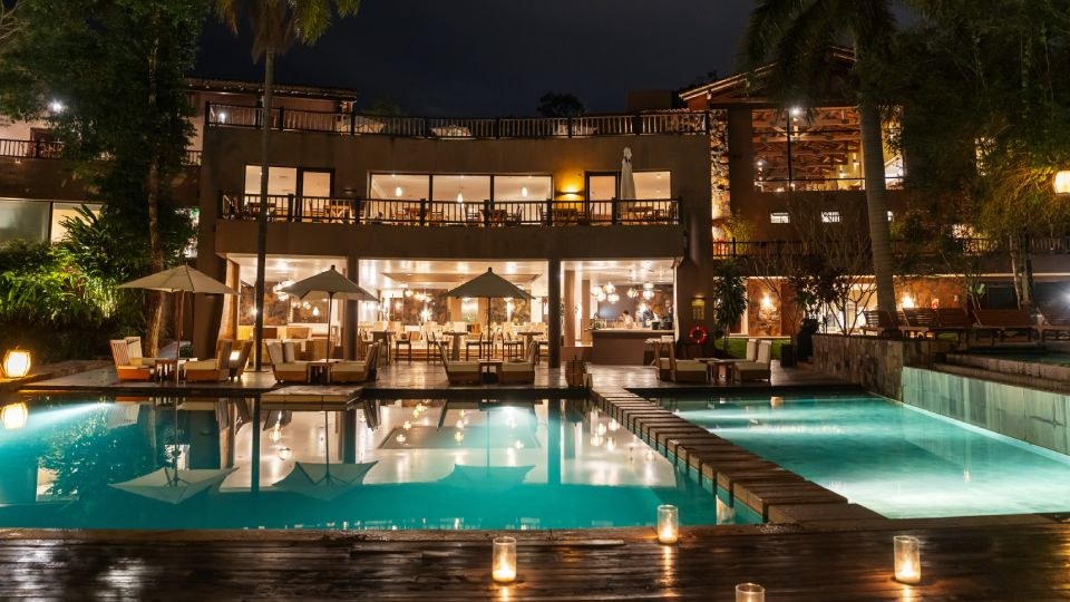 The hotel pools illuminated at night