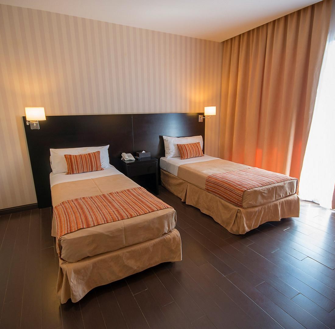 Twin beds in a Master Double room